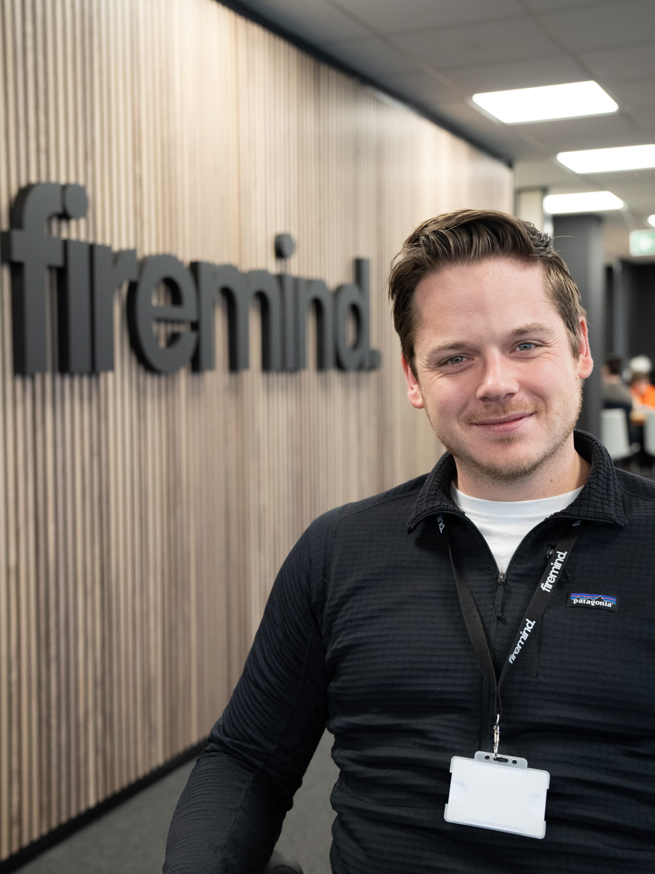 A picture of Rob Gehring in portrait, in front of Firemind signage